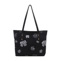 Borsa tote nera minimalista con stampa floreale bianca e borchie dorate sul fondo - Nero