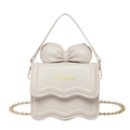Mini cream white crossbody bag with oversized bow detail and gold chain strap for women - Beige