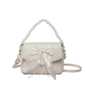 Cream underarm bag featuring large organza bow and elegant pearl handle strap - Beige