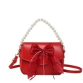 Elegant red shoulder bag featuring a pearl handle and a large silk bow with rhinestones - Red