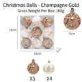 Detalle de bolas de Navidad de 6cm caladas en champán y blanco pintadas en caja de 9 - Champán dorado