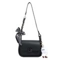 Minimalist black square crossbody bag with a striped bow and plush pendant on white background - Black With Pendant