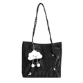Black tote bag with wrinkled texture, silver butterflies, and white cloud charm accessory - Black With Pendant
