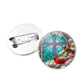 Round glass brooch featuring red cardinal birds and a cross in a winter scene ornament. - Cardinal and Cross (JY007876-3)