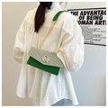 Detail of green and white patchwork envelope bag with gold M buckle and chain strap - Green