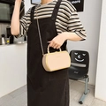 Beige faux leather box bag with gold frame and chain strap, styled for commuting - Khaki