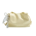 Creamy yellow cloud pouch bag with pleats, pearl charms, and lace bow on white background - Yellow
