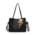 Black pebbled leather tote bag with geometric wide strap and plush bear charm - Black With Pendant