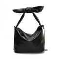 Glossy black patent leather tote bag with large decorative bow handle and silver chain - Black