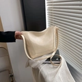 Chic beige oil wax leather bucket bag for daily commute with adjustable strap - With Pendant / White