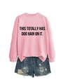 Flat lay of pink crewneck sweatshirt with text and distressed denim shorts on white background - Pink (Black Font)