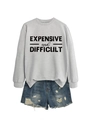 Close-up of EXPENSIVE and DIFFICULT letter print on a grey long sleeve sweatshirt - Grey (Black Print)