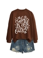 Close-up of brown sweatshirt with snowflake pattern and distressed denim shorts detail - Coffee (White Font)