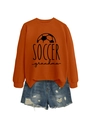 Close-up of burnt orange Soccer Grandma sweatshirt with graphic print and denim shorts - S / Burnt Orange (Black Print)