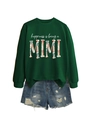 Detail of green crewneck sweatshirt with happiness is being mimi text and denim shorts - Dark Green (White Letters Graphic)