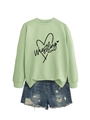 Detail of light green Wrestling Mom sweatshirt with distressed denim shorts on plain background - Olive Green (Black Font)
