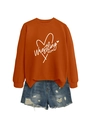 Flat lay of an orange Wrestling Mom sweatshirt with distressed denim shorts - Burnt Orange (White Font)