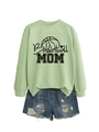 Detailed view of mint green Basketball Mom sweatshirt paired with distressed denim shorts - Olive Green (Black Print)