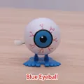 Blue eyeball wind-up toy with red bloodshot veins and blue feet for Halloween - Blue Eyeball