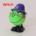 Wind-up green witch toy with purple hat and orange hair for Halloween gift - Green Witch