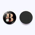 Magnetic fridge magnet with gold letter B and floral pattern on black glass surface - Letter B