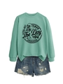 Detail of mint green sweatshirt with 'HAVE THE DAY YOU DESERVE' slogan and skull graphic - S / Light Green (Black Print)