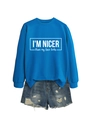 Detail of blue sweatshirt with slogan print and distressed denim shorts texture - Lake Blue (White Font)