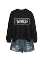 Flat lay of black sweatshirt with slogan and distressed denim shorts outfit set - Black (White Font)