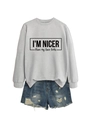 Flat lay of light grey sweatshirt with I'm nicer than my face looks slogan and denim shorts - Grey (Black Font)
