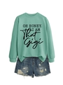 Detail of mint green sweatshirt with 'Oh Honey' print and distressed denim shorts - Light Green (Black Text)
