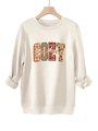 Détail de l'imprimé COZY season avec motif léopard et carreaux sur sweat en polaire - Sable