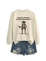 Flat lay of beige oversized sweatshirt with funny cowboy frog graphic and denim shorts - S / Sand (Black Letters)