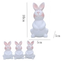 White plastic Easter bunny ornaments set featuring pink ears and smooth surface - White