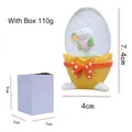 Easter bunny glass egg ornament with yellow resin base and white gift box packaging - Rabbit with Flowers - Yellow Base Red Bow