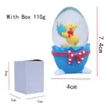 Bola de nieve huevo de Pascua con pollito amarillo, base azul y caja de regalo blanca - Azul (Pollito)