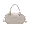 Chic beige Boston-style bowling bag with dual handles and gold-tone FASHION & BAGS text - Beige
