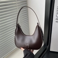Dark brown hobo shoulder bag with silver bow detail and half-moon leather design - Brown