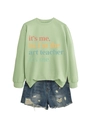 Detail of green art teacher sweatshirt paired with distressed blue denim shorts - Olive Green