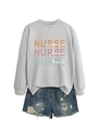 Detail of grey sweatshirt with 'NURSE inspire love heal' text and distressed denim shorts - Gray