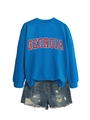 Flat lay detail of a blue Georgia sweatshirt paired with distressed denim shorts - S / Lake Blue