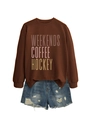 Detail view of the Weekends Coffee Hockey art print on a brown sweatshirt fabric - S / Coffee