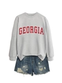Flat lay of gray crewneck Georgia sweatshirt with distressed blue denim shorts - Gray