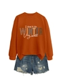 Detail view of orange graphic sweatshirt with I don't do winter slogan and ripped denim shorts - Rust Orange (White Graphic)