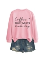 Detail of pink crewneck sweatshirt with black Coffee Baggy Sweater printed text design - Pink (Black Font)