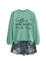 Detail of mint green coffee sweater showing ribbed cuffs and distressed denim shorts - Light Green (Black Font)