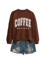 Flat lay of brown long sleeve Coffee Weather sweatshirt and distressed denim shorts - Coffee Sweatshirt (White Text)