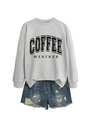 Flat lay of a grey crewneck sweatshirt with Coffee Weather print and ripped denim shorts - Grey Sweatshirt (Black Text)