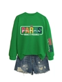 Dettaglio della felpa verde brillante con stampa PARAS MAKE IT POSSIBLE e shorts in denim - S / Verde erba (Grafica bianca)