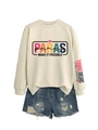 Flat lay of cream crewneck sweatshirt with colorful PARAS print and ripped denim shorts - Sand (Black Graphic)