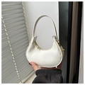 Detailed view of a white PU leather crescent bag with gold zipper and hardware - White